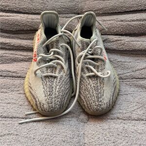 Yeezy Gray and White Sneakers with Red Accents